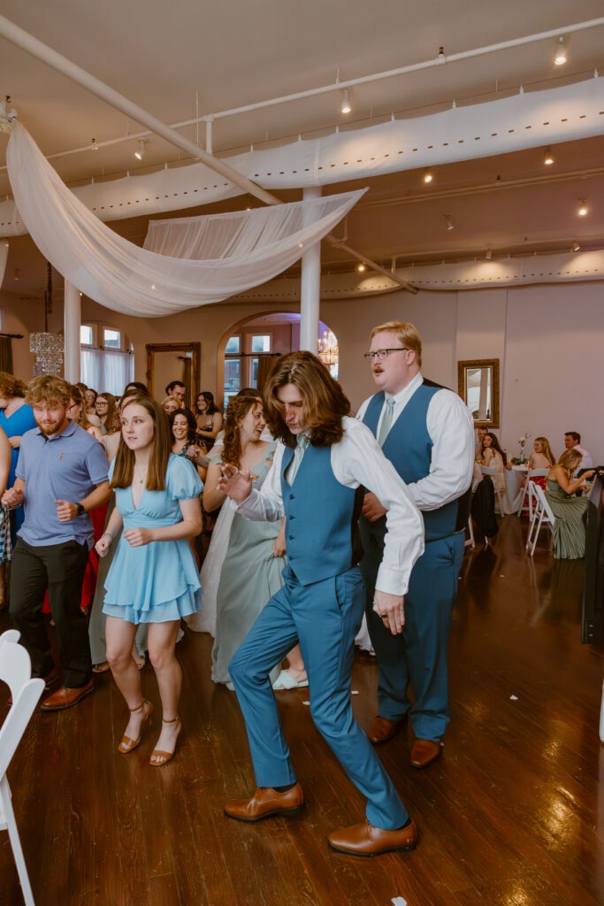 Rachel & Elliott's elegant wedding at the historic Winchester Opera House in Winchester, Kentucky, captured by Kentucky wedding photographer A Pair of Perry's Photography, featuring classic decor and romantic details.